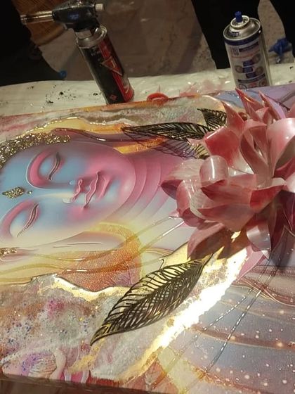 This image shows a 3D Buddha photo art piece in progress. You can see the handmade lotus flower being assembled before the final resin pour.