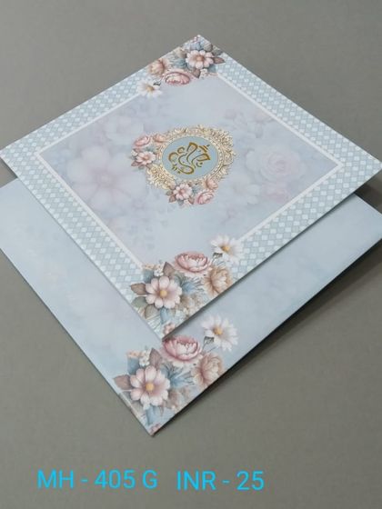A pastel blue invitation with a floral border and a Ganesha emblem at the center. This affordable card is perfect for a sweet and simple wedding announcement.