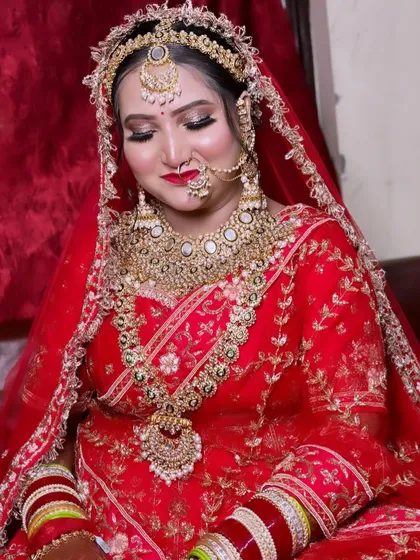 A close-up of this stunning bride in red. Her look features bold eyes, a classic red lip, and a flawless base that highlights her features beautifully.