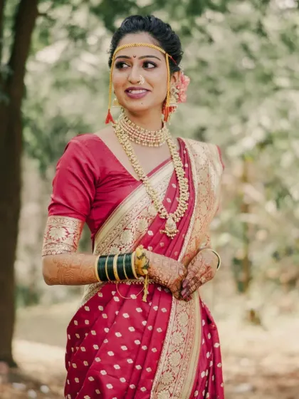 A close-up of Priyanka's bridal look, featuring a traditional mundavalya and subtle, glowing makeup.