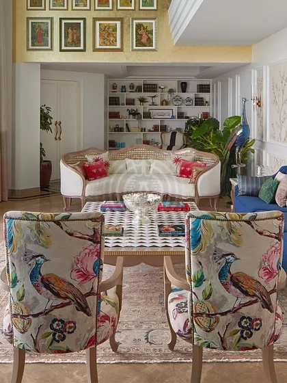 Your walls are a canvas waiting for a story. For this living room, I designed a custom wallpaper with delicate, blossoming branches, creating a serene and elegant backdrop that feels like stepping into a timeless garden.