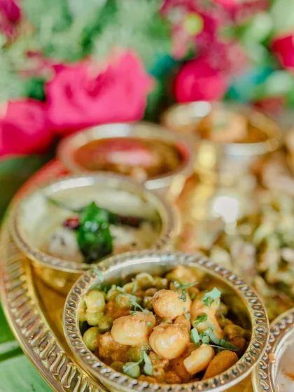 A detailed look at the small bowls, or 'katoris', from our thaali, each containing a different, flavourful preparation like Paneer Lababdar and a mixed vegetable curry.