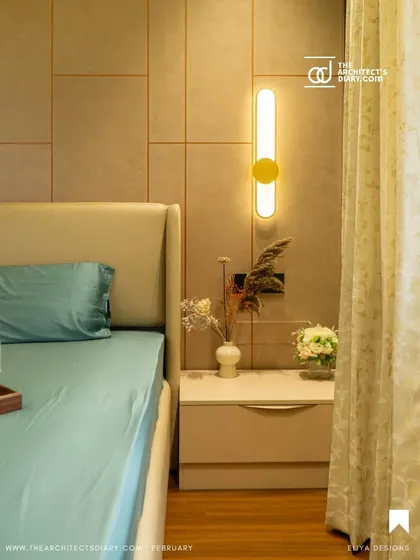 The serene bedroom from the Anagha project, with its minimalist bedside setup and warm lighting, as featured in the publication.