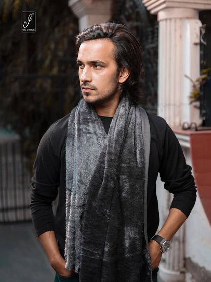 A classic portrait focusing on the model's expression and the texture of the fur-like scarf, perfect for a winter accessories campaign.