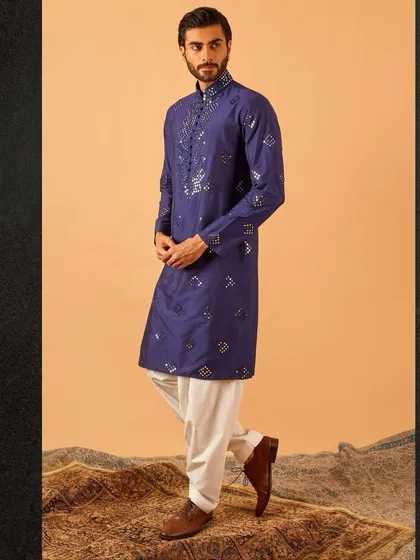 This royal blue kurta with scattered mirror work is a perfect blend of tradition and modernity. It’s a standout piece that is both festive and sophisticated.