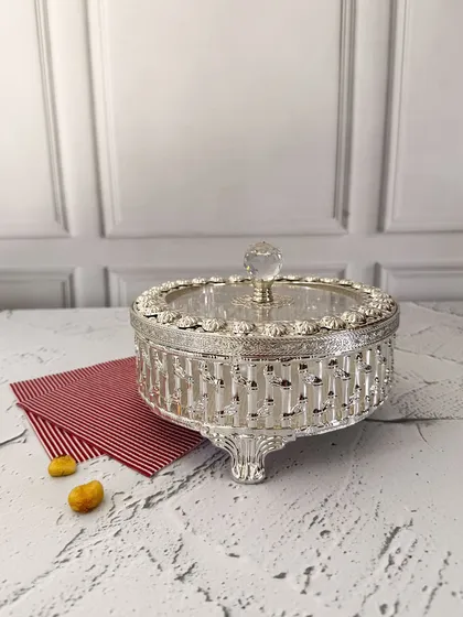 The full view of the ornate dry fruit box showcases its elegant feet and detailed latticework. It is a piece designed to be a centerpiece on any table.
