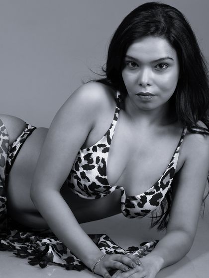 A black and white portrait in an animal print bikini. The monochrome style gives this bold look a classic and artistic interpretation.