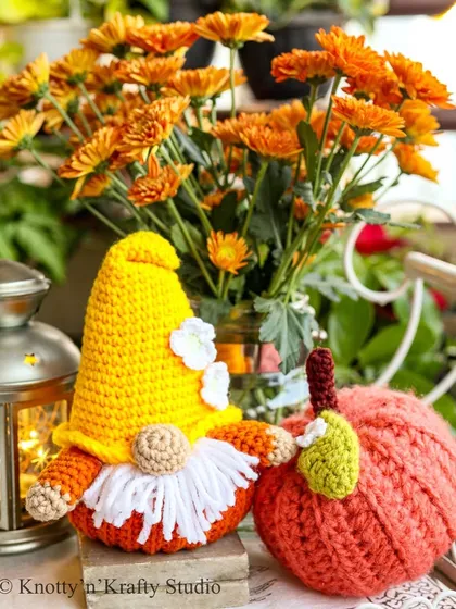 Welcoming the cozy season with my whimsical autumn decor. This little Pumpkin Gnome, with his fluffy white beard and pointy yellow hat, sits beside a crochet pumpkin, bringing the warm colors of fall right into your home.