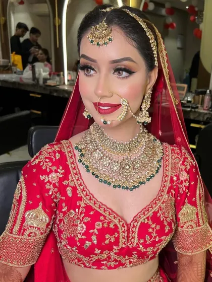A beautiful profile shot highlighting the intricate nath and the elegant layers of the bridal necklace.