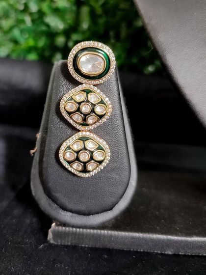 The matching earring, featuring three circular kundan elements for a contemporary feel.