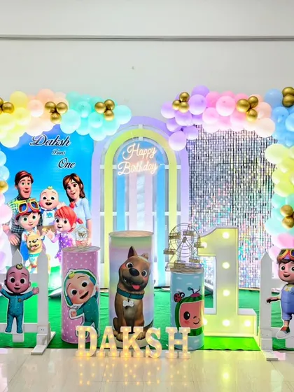 A bright and cheerful Cocomelon theme, one of our most popular kids' party decorations. This setup includes a full backdrop with a shimmer wall, a pastel balloon arch, and multiple cutouts of the Cocomelon characters.