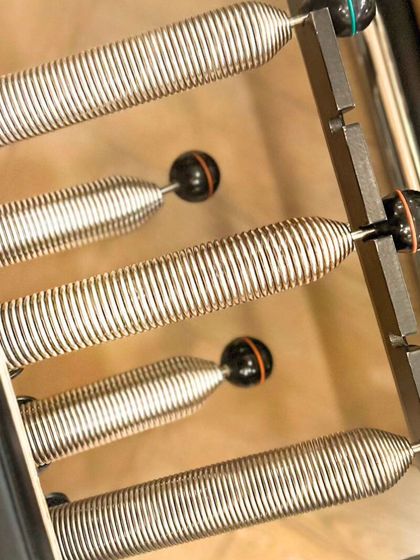 The adjustable springs of the Reformer allow for customized resistance, enhancing strength and muscle tone for every individual.