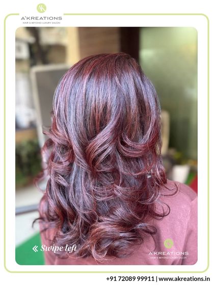 These subtle red-toned highlights are woven through the hair to add warmth and richness, creating a beautiful auburn glow.