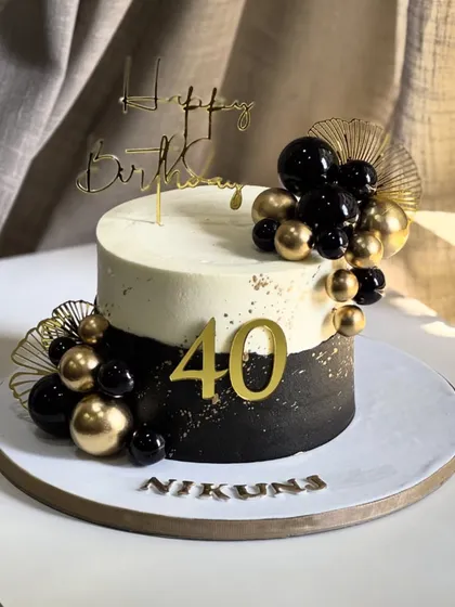 Stepping into the fabulous forties in style! This elegant black and gold masterpiece celebrates a milestone birthday with shimmering accents and a bold, sophisticated design.