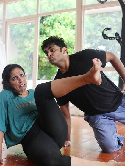 An actor in a dramatic pose during a "Gretel" rehearsal.