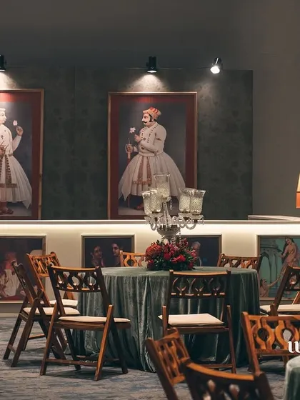 A full view of the bar and seating area, showing how the space is designed for both celebration and conversation. The art is integrated seamlessly into the event's flow.