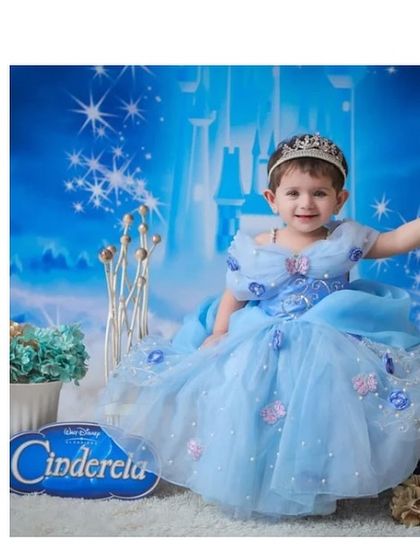A dream come true for a little Cinderella fan. This custom gown was made for baby Manahil's first birthday, featuring the classic blue color, puffy sleeves, and butterfly details.