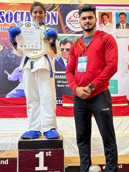As a coach, these are the moments I live for. Standing beside my student Shikha as she receives her gold medal, knowing she will now represent the official Karnataka State Karate Team.