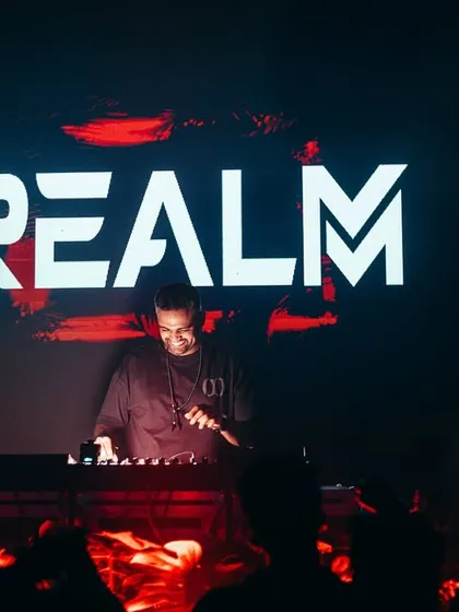 My name in lights. A strong branding shot of me at the console with my "REALM" logo displayed prominently on the screen behind me.