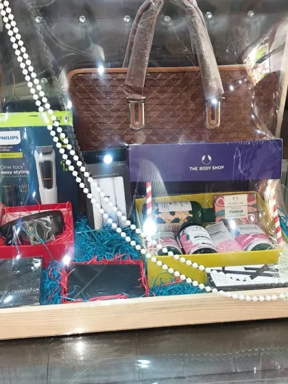 Here is a complete gift hamper for a groom, including a laptop bag, grooming kit, wallet, and other essentials. I arrange everything neatly in a wooden tray so it looks organized and feels premium.