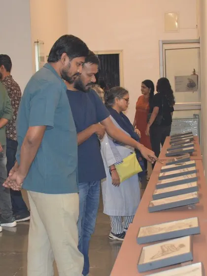 The artist explaining her work to a group of visitors.