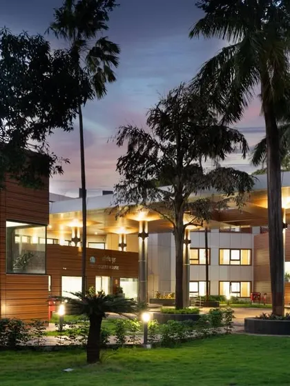 The guest house viewed from the lawn, showing the new facade and the relationship between the building and its landscape.