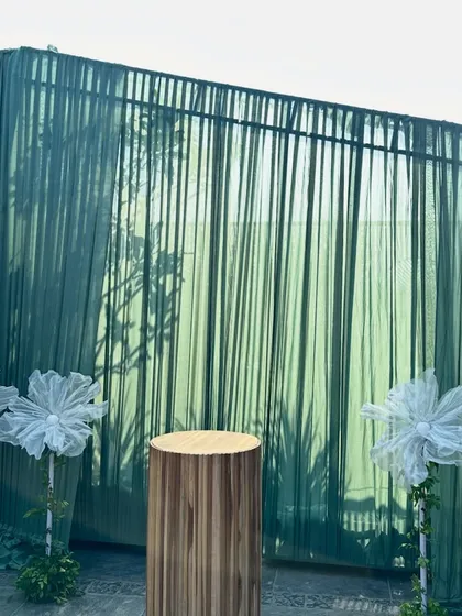 A simple yet elegant cake-cutting station for a baby shower. The sage green backdrop and minimalist wooden pedestal perfectly complemented the rustic and natural theme of the event.