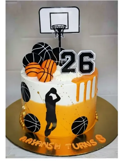 A basketball-themed cake for a 26th birthday. This chocolate truffle cake has an orange drip and is decorated with basketballs and a hoop.