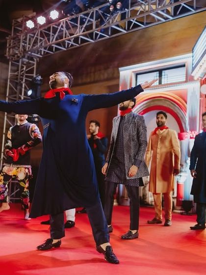 The groom's father leads the charge in this high-energy groomsmen performance, proving that age is just a number when it comes to dancing.