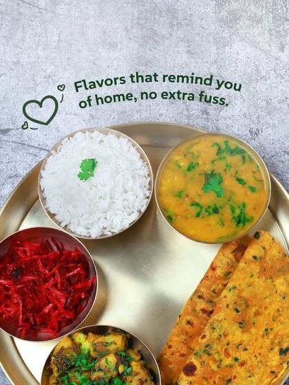 Flavors that remind you of home, with no extra fuss. Our veg thali with aloo sabzi, dal, and methi thepla is simple, nutritious, and delicious.