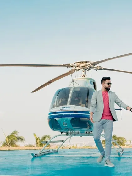 Making a grand entrance into their new life together. This stylish shot from a helicopter pre-wedding shoot in Pune is the definition of luxury and modern romance, creating an unforgettable memory.