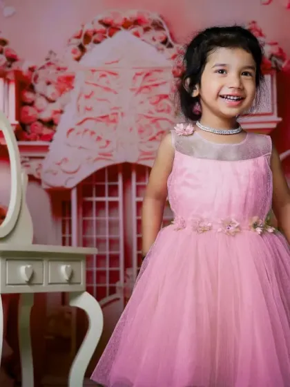 A perfect smile from our princess in pink. We have a variety of beautiful dresses available in our studio wardrobe.