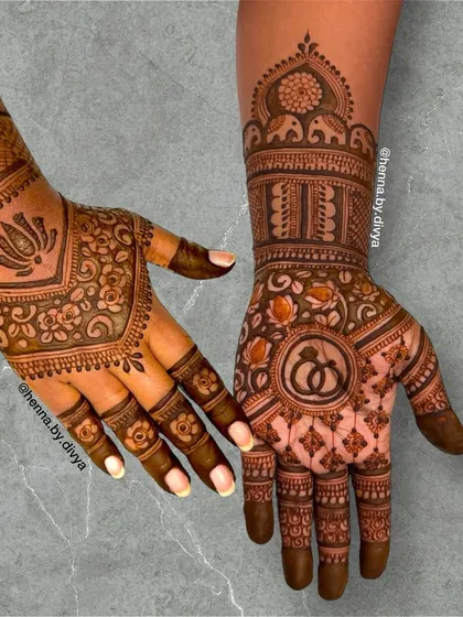 A special design for an engagement ceremony, featuring interlocking rings as the centerpiece on one hand. The other hand includes a lotus and elephant band, symbolizing prosperity and love.