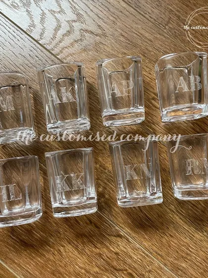 Here's to the nights you'll always remember. Our personalized engraved shot glasses are a classy way to commemorate a special occasion, each customized with the initials of your friends.