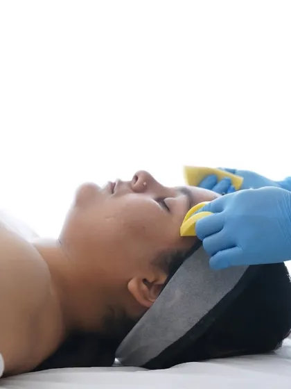 The cleansing step of the Fruit Facial uses gentle sponges to wipe away impurities, leaving the skin fresh and ready for the nourishing mask and serums that follow.