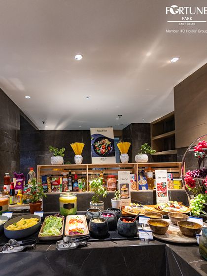 The salad and cold cuts section of our buffet, offering a healthy and refreshing start with a variety of greens, dressings, and imported cheeses.