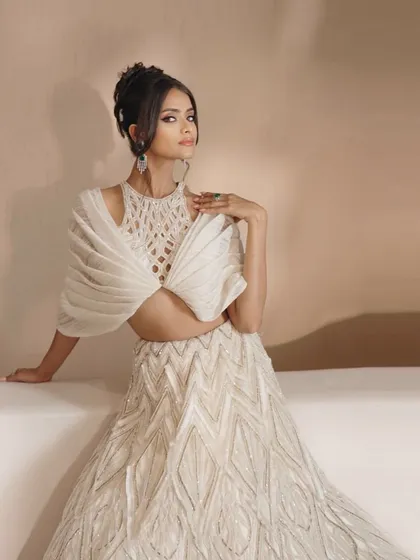 My ivory embellished cocktail lehenga, a masterpiece crafted for the modern bride who wants to shine and make an unforgettable impression.