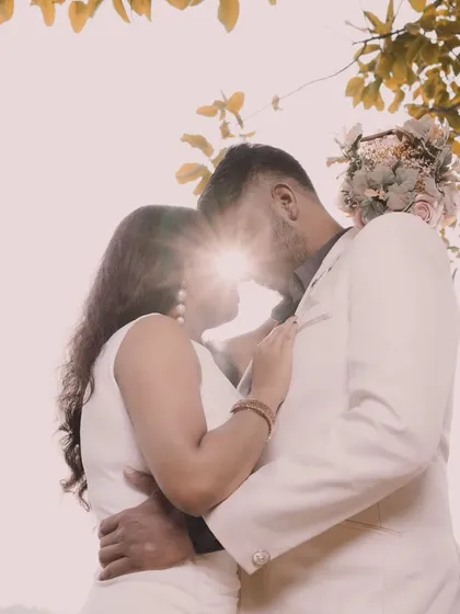 An artistic and romantic shot using a sun flare. This creative technique adds a dreamy and magical quality to your announcement photo.