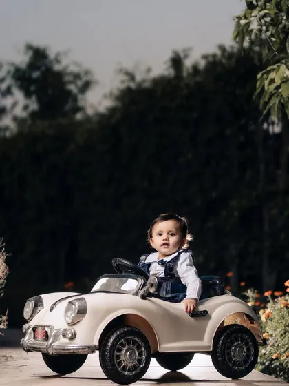 A stylish little driver in her vintage convertible. I love using these ride-on car props to create fun, imaginative portraits for toddlers.