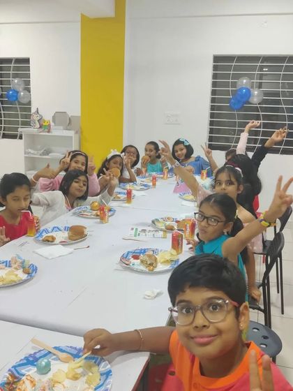 A table full of happy kids enjoying their party snacks. I make sure there's a perfect balance of art time and party time.