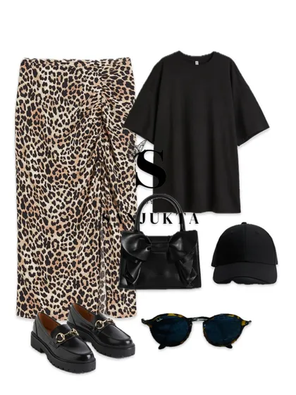 For a more casual take on the leopard print skirt, I've styled it with an oversized black t-shirt and chunky loafers. This demonstrates how a single statement piece can be dressed up or down depending on the occasion.