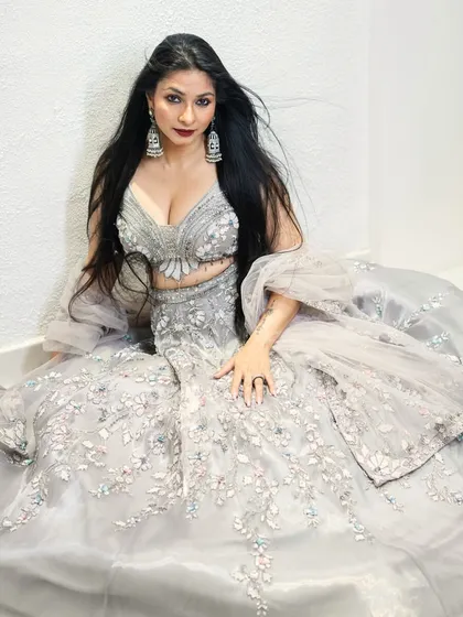 Tanishaa Mukerji looking radiant in the complete designer lehenga set. This angle highlights the flattering cut of the blouse and the voluminous skirt, proving pre-loved can be red-carpet ready.
