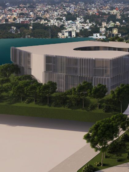 Another view of the campus rendering, showing the building's unique, curved form. The design is clean, modern, and built for productivity, with an open layout and smart work zones that blend style and function.