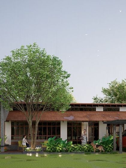 Set in the serene landscape of Kodagu, this eco-conscious retreat is designed for sustainable living. The single-story structure with its gently sloping roof and wide eaves sits lightly on the land, surrounded by existing trees to create a harmonious blend of modern living and nature.