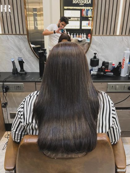 And this is the stunning 'after'. Our Hair Botox treatment has completely revitalized the hair, leaving it sleek, smooth, and full of healthy shine from root to tip.