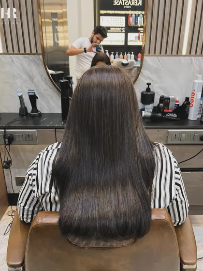 And this is the stunning 'after'. Our Hair Botox treatment has completely revitalized the hair, leaving it sleek, smooth, and full of healthy shine from root to tip.
