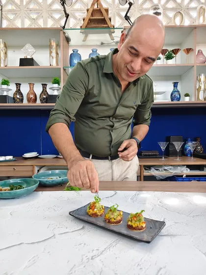 Every dish we create is a piece of our passion. Here, I'm adding the final touches to our open quesadillas, ensuring each appetizer is a perfect blend of flavor, texture, and artistry before it reaches your guests.