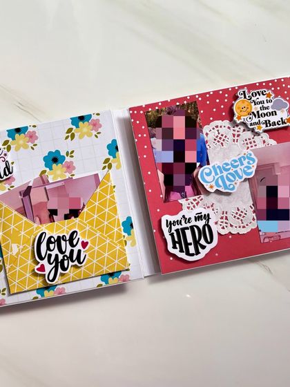 A peek inside a personalized flipbook album. This page has a pocket with a "love you" sticker and space for photos and notes.