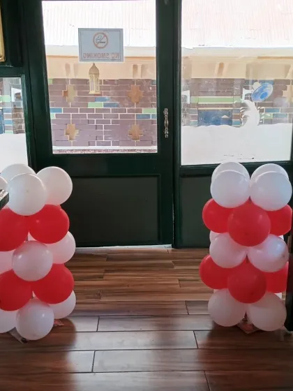 We also added matching balloon pillars at the entrance to the decorated area.