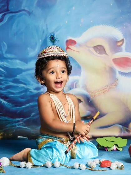 The joy and excitement of being little Krishna! This toddler's happy expression is priceless in this fun and vibrant Janmashtami themed shoot.
